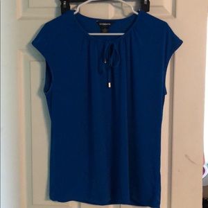 Sleeveless bright blue shirt